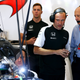Dennis (in the blue) speaking with members of the McLaren F1 team at Spa-Francorchamps, 2016. Photo credit: Charles Coates/Getty Images